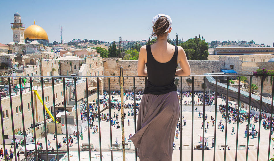 Women looks on at Jerusalem old city, Israel